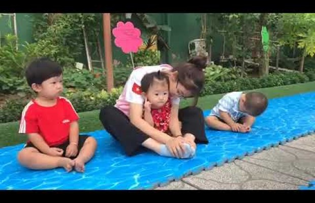 The kids do warm-up activity in the morning with Yoga teacher